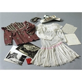 AN ASSEMBLAGE OF PERSONAL OJECTS: A JADE PRE-COLUMBIAN BEAD NECKLACE, A TEHUANA HEADDRESS, AN APPLIQUED BLOUSE, A CARVED AND PAINTED SKELETON, A HANDWRITTEN LETTER BY DIEGO RIVERA AND FRIDA KAHLO TO LEON TROTSKY, AN ADDRESS BOOK AND TWO BLACK AND WHITE PHOTOGRAPHS