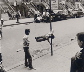 Walter Rosenblum, Chinning on Pole, 105 St., NYC., 1952
