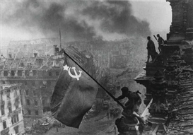 Yevgeny Khaldei, Raising the Soviet Flag over the Reichstag, Berlin (1945)
