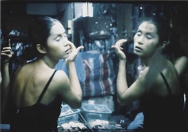 Nan Goldin, C putting on her make-up at Second Tip: Bangkok