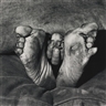Roger Ballen, PUPPY BETWEEN FEET