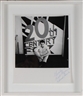 Joe Goode, Ed ruscha in front of large trademark with spotlights
