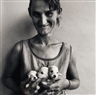Roger Ballen, WIFE OF ABATTOIR WORKER HOLDING THREE PUPPIES, ORANGE FREE STATE, 1994