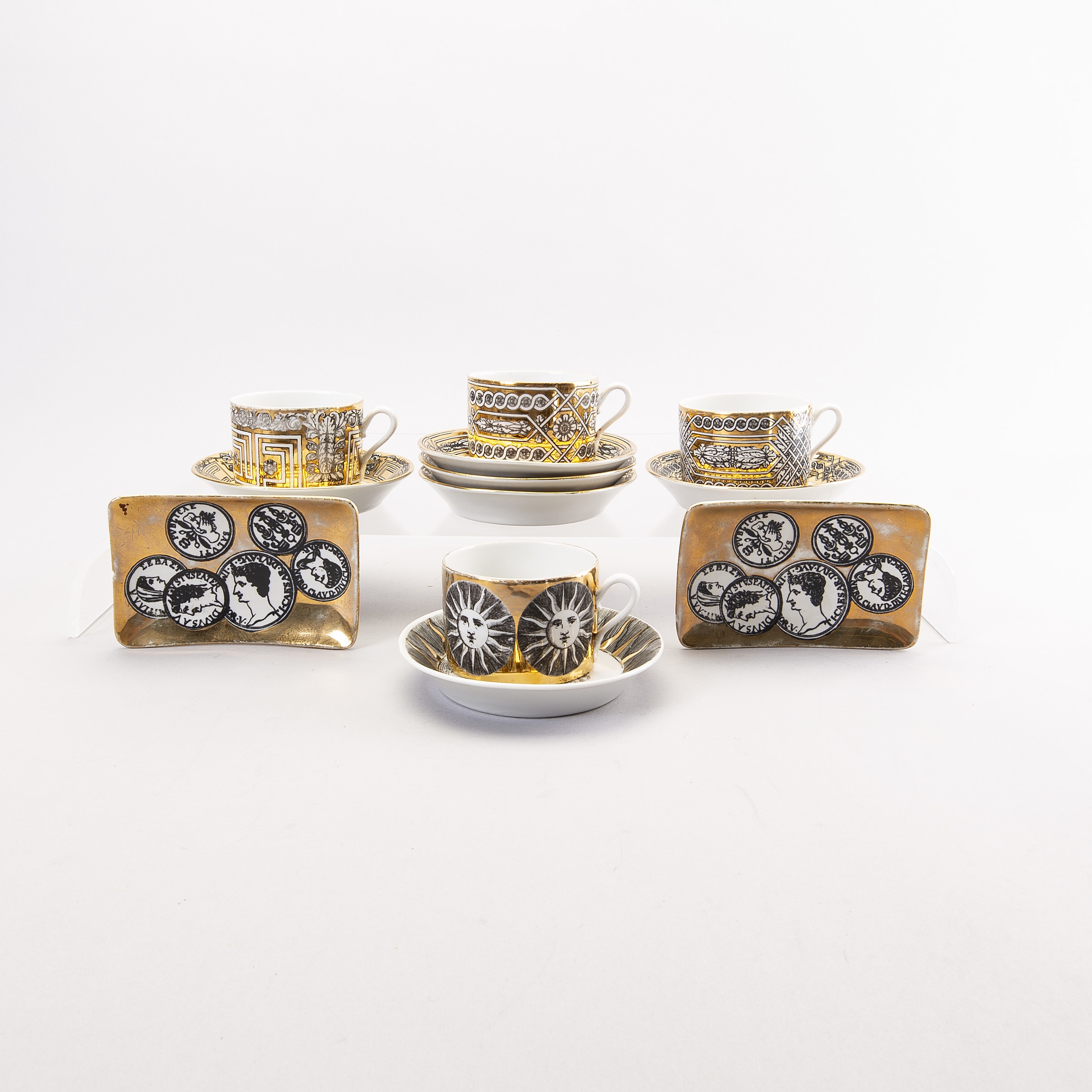 Piero Fornasetti | Piero Fornasetti a set of four coffee cups with 
