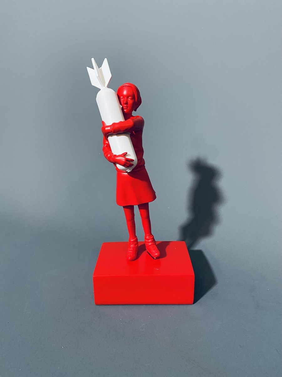Banksy | Bomb Hugger Toy – Red & White | MutualArt