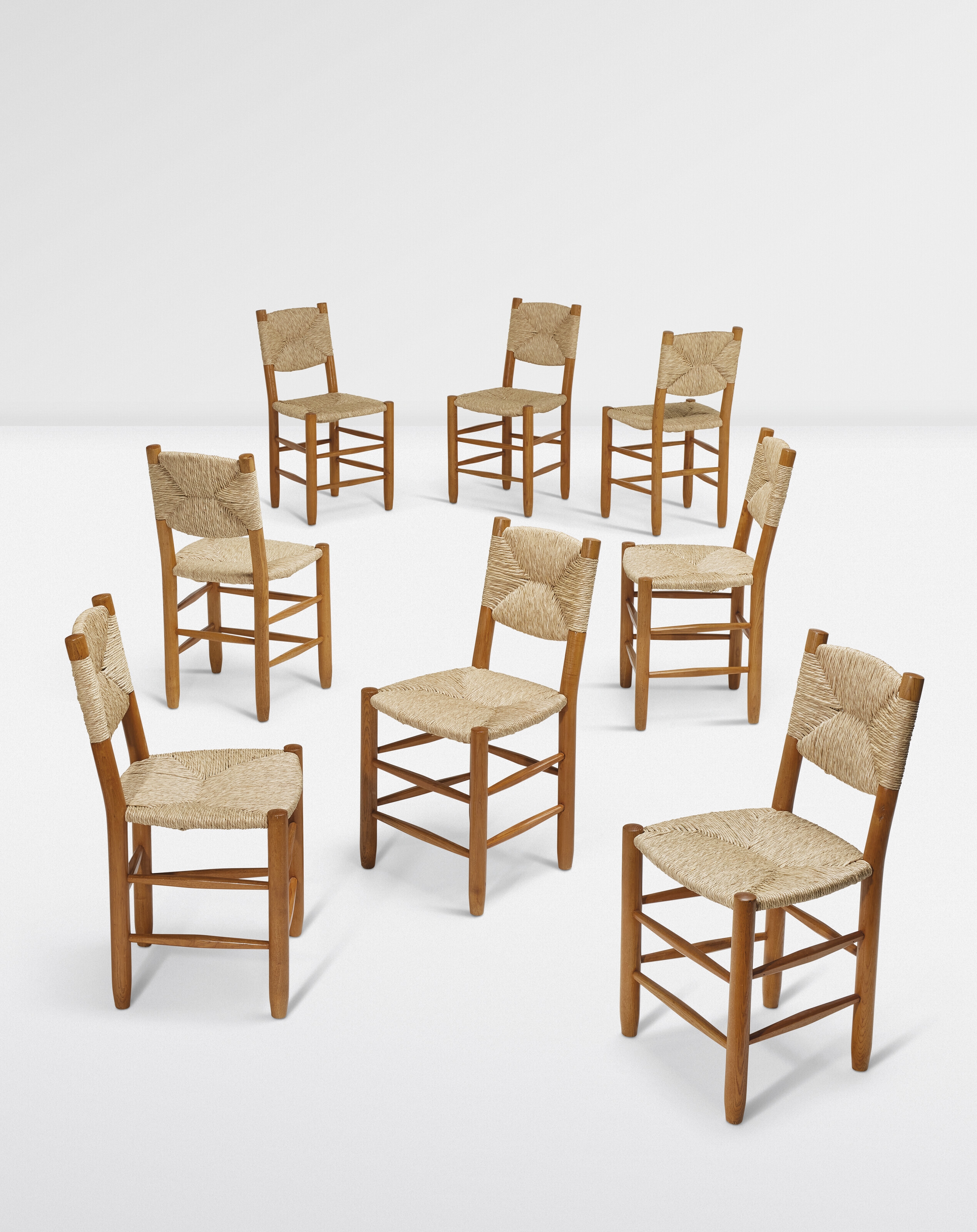 Charlotte Perriand | ENSEMBLE DE HUIT CHAISES 