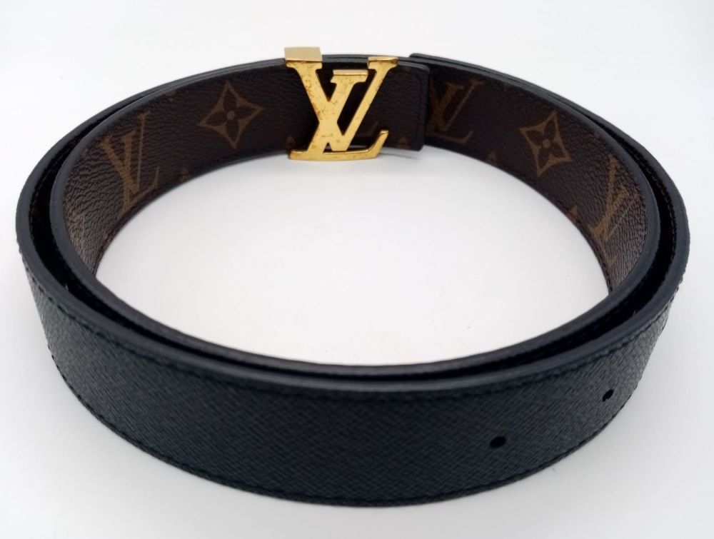 Louis Vuitton, A Louis Vuitton Black Leather Belt. Gilded monogram