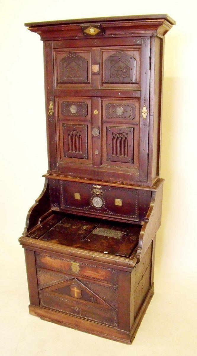 Queen Victoria | An unusual Sunday school Cabinet with cupboard enclosing  shelves over drop front the box bare with lift up lid, the whole with  applied commemorative medallions relating to the Sunday