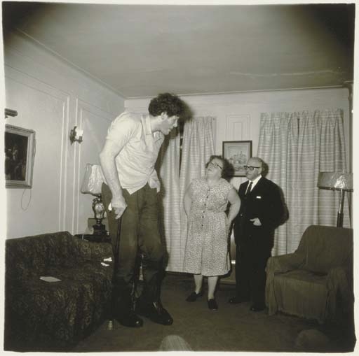 A Jewish giant at home with his parents in the Bronx, N.Y., 1970