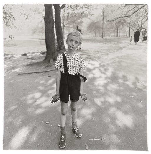 Child with a toy hand grenade in Central Park, N.Y.C. by Diane Arbus, 1962, printed later