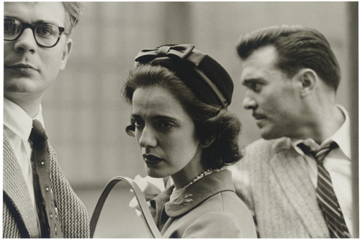 Woman on the street with two men, N.Y.C. 1956 by Diane Arbus