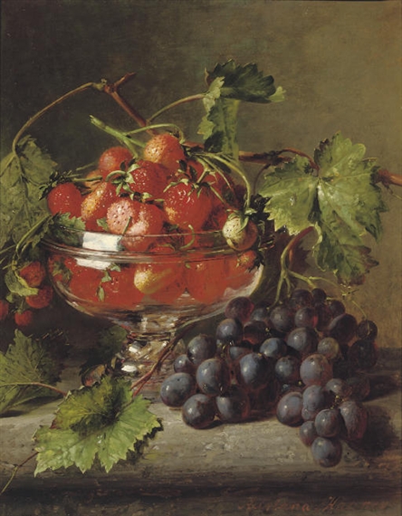 Strawberries in a glass bowl with grapes on a ledge