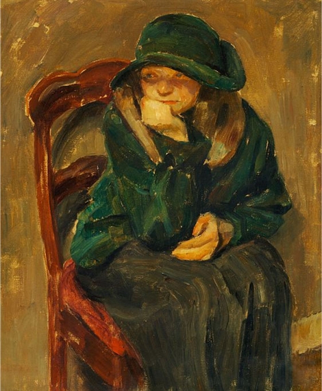 Thoughtful young girl in a green jacket and hat