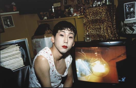 Tomoyuki in Front of T.V., Tokyo  by Nan Goldin, 1994