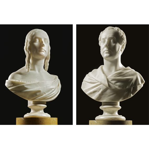 a pair of marble busts of a lady and gentleman
