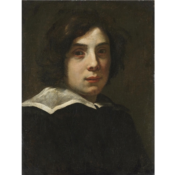 Portrait of a young man, head and shoulders, wearing black with a white collar