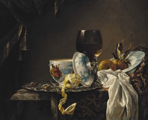 A still life of china, a goblet, fruit and a peeled lemon on a table by Willem Kalf