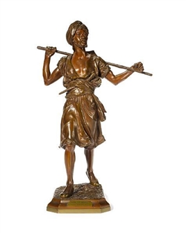 A bronze figure of an Arab man walking - Emile Pinedo