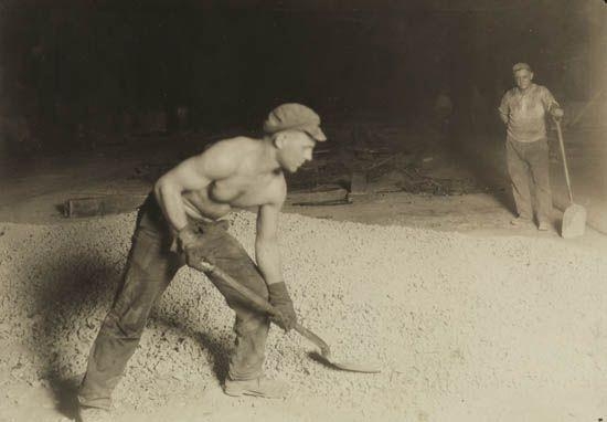 "Shoveling Limestone Into Steel Furnace, Bethlehem Steel Co." by Lewis Hine, 1909; printed 1920s
