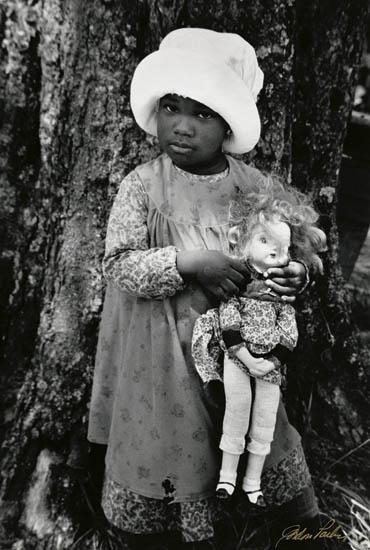 Untitled (young child with doll, from the film "The Color Purple") by Gordon Parks, 1985