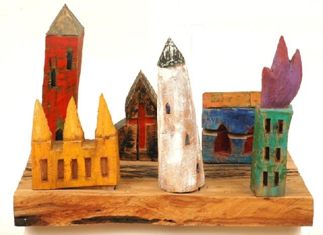 Artwork by Ross Laurie, Townscape  ( in 7 parts), Made of Painted carved wooden sculpture on base