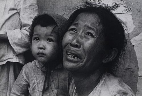 South Vietnamese mother and her child, who were driven out of their homes by intense fighting by Philip Jones Griffiths, Circa 1968