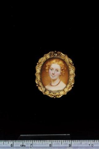 Artwork by William John Thomson, A young Girl, with auburn hair, wearing dress trimmed with white lace and a coral bead necklace, Made of gilded gold bracelet frame