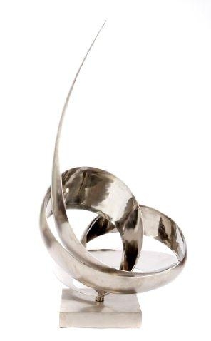 A sleek, modern sculpture featuring interlocking silver bands and a soaring curved blade.
