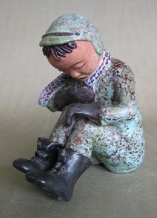 Seated Boy in Boots by Dorothy S. Harkins