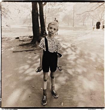Child with a toy hand grenade in Central Park, NYC, 1962 by Diane Arbus, printed 1963