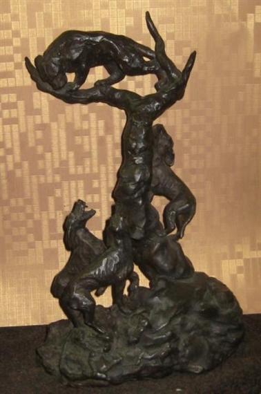 A dark bronze sculpture depicting a dynamic scene of figures and animals in motion.
