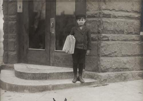 Newsboy by Lewis Hine, 1910