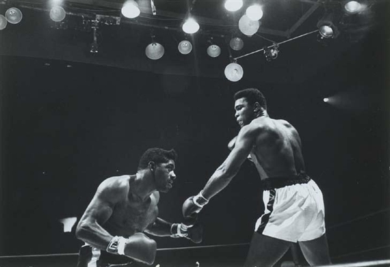 Cassius Clay (who would soon rename himself Mohammed Ali) in the ring with Floyd Patterson by Arthur Rickerby, 1965