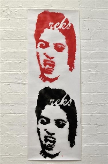 A vertical stencil artwork featuring two stylized faces in red and black against a white brick wall.