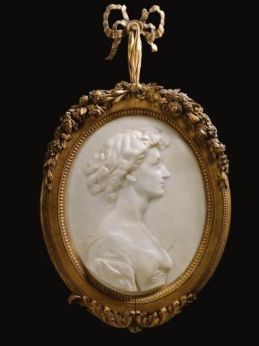 Artwork by Francis Derwent Wood, Relief portrait of Mrs George Crawley, Made of white  marble  in  a  gilt  wood  frame