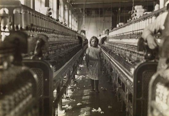 Young spinner at looms