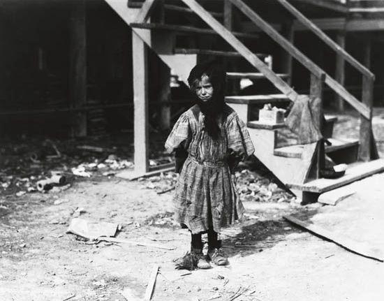 Katie Kuritzko, a 7-year-old Oyster Shucker by Lewis Hine, 1911