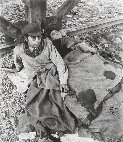 Tramp under a bridge by Robert Doisneau, circa 1950