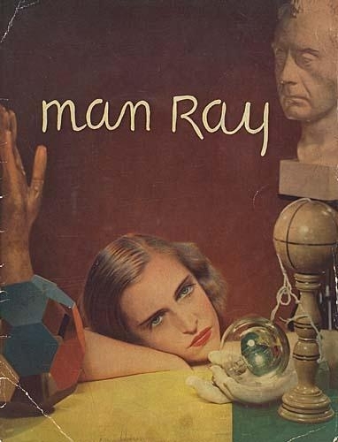 A surreal collage featuring a reclining figure, a bust, and geometric shapes against a deep red background.