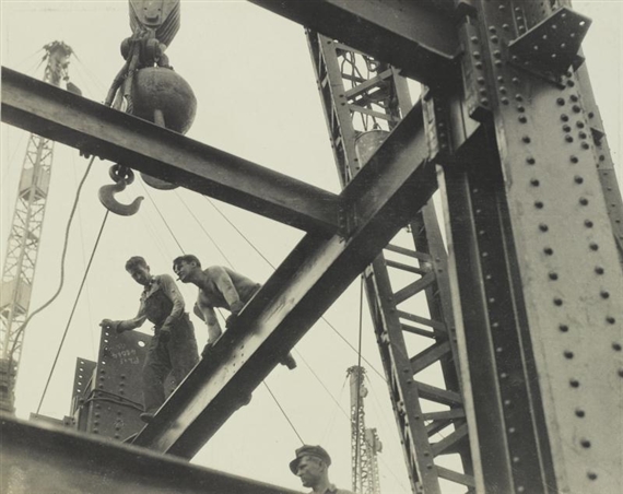 THE "STEEL WORKERS" ARE ALWAYS ON TOP. "CONSTRUCTORS" LAY A BEAM. EMPIRE STATE by Lewis Hine, circa 1930
