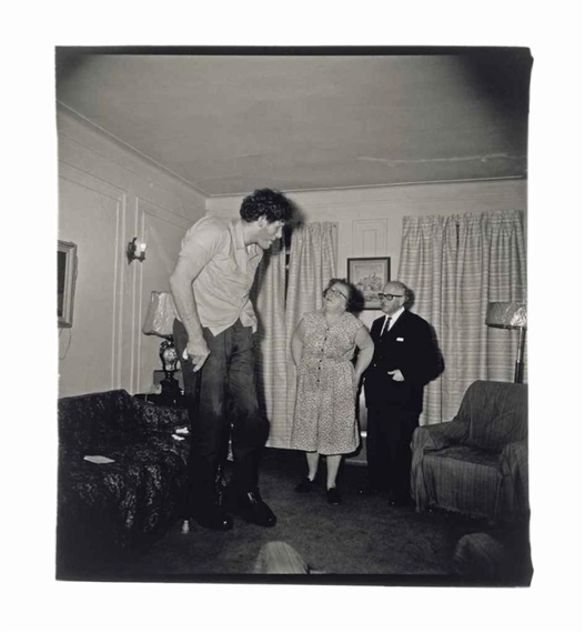 A Jewish giant at the home of his parents, Bronx, from 'A Box of Ten' by Diane Arbus, 1967