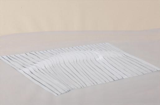 A minimalist textile piece featuring vertical pleats and a subtle central fold.