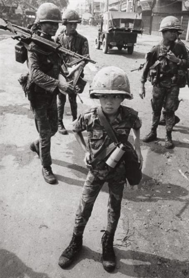 Untitled (Ten Year Old South Vietnamese Solider) by Philip Jones Griffiths, 1968