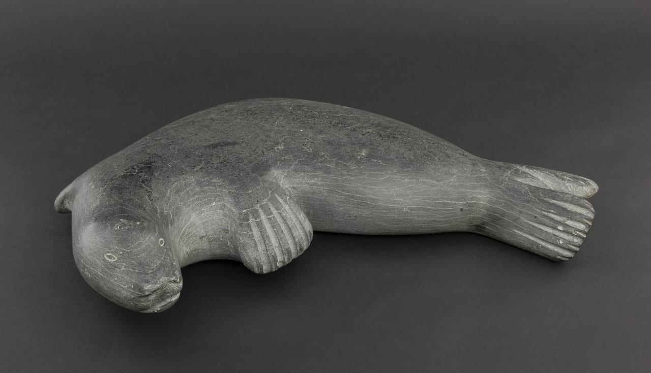 Artwork by Mark Taletok, Carving of a seal, Made of grey stone
