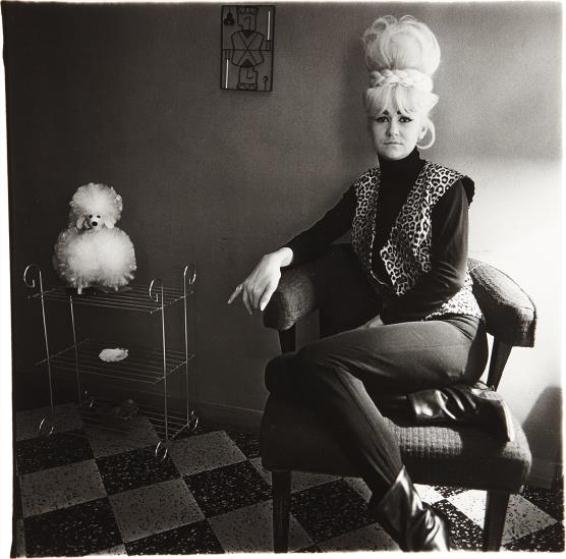 Lady bartender at home with souvenir dog, New Orleans by Diane Arbus, 1964, printed later