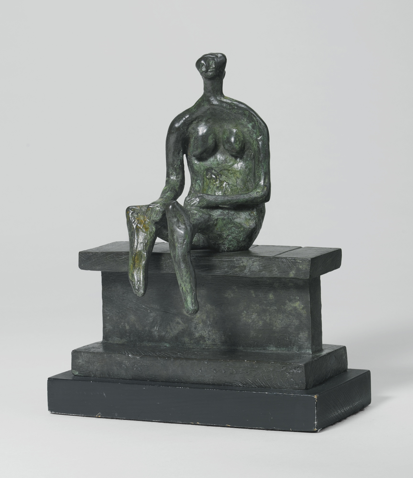 SEATED FIGURE ON A LEDGE by Henry Moore, 1957