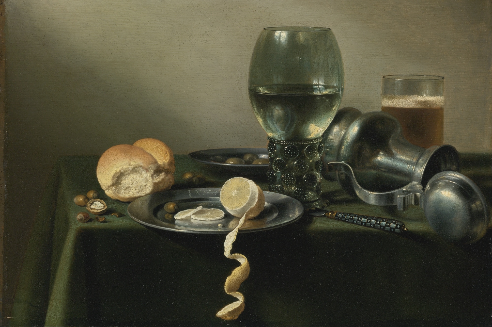 A ROEMER, AN OVERTURNED PEWTER JUG, OLIVES AND A HALF-PEELED LEMON ON PEWTER PLATES by Pieter Claesz, 1635