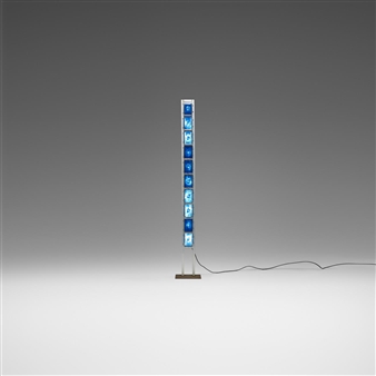 A minimalist floor lamp featuring a vertical stack of glowing blue square modules against a neutral gradient background.