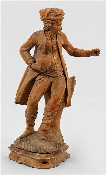 Allegorical figure with turban and canonball