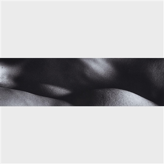 A minimalist black and white portrait focusing on the texture of skin.